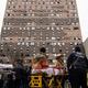 Emergency personnel work at the scene of a fatal fire at an apartment building in the Bronx on Sunday, Jan. 9, 2022, in New York.